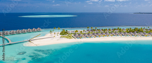 Sea beach aerial. Luxury summer travel vacation landscape. Tropical beach, drone view. Beach villas bungalows of hotel resort. Perfect beach scene vacation, summer holiday template. Wonderful nature
