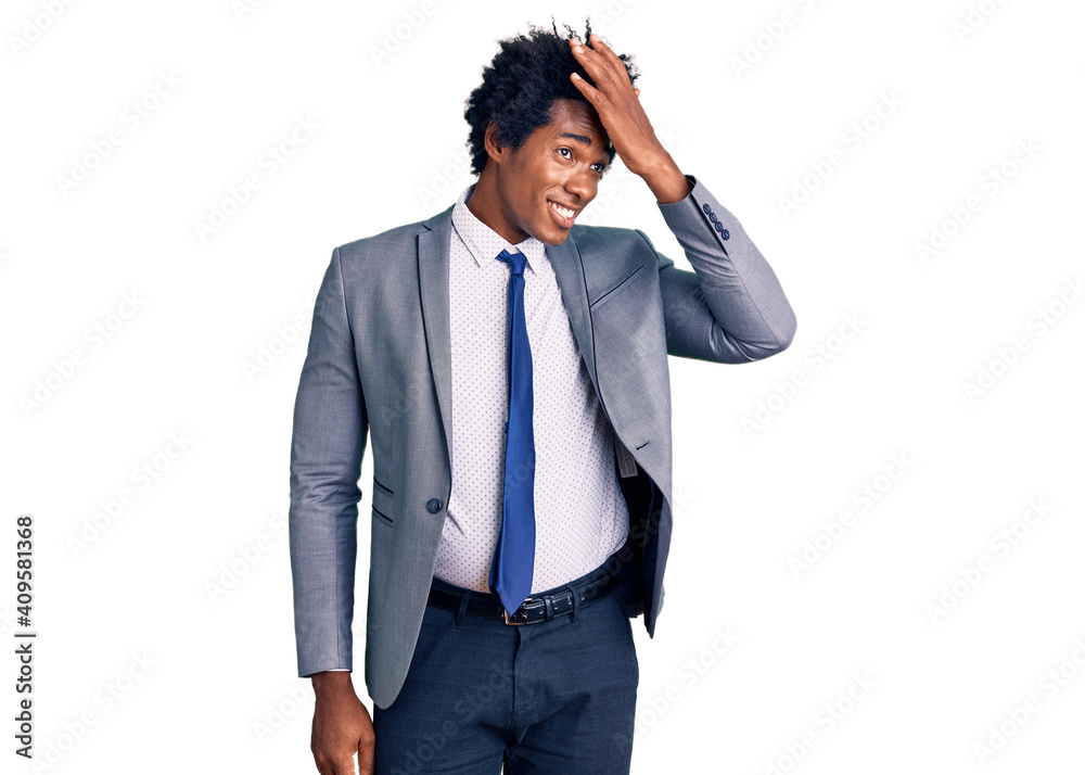 Handsome african american man with afro hair wearing business jacket smiling confident touching hair with hand up gesture, posing attractive and fashionable Handsome african american man with afro hair wearing business jacket smiling confident touching hair with hand up gesture, posing attractive and fashionable