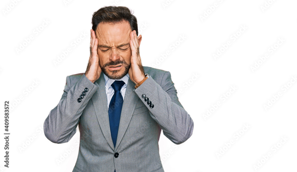 Middle age man wearing business clothes with hand on head, headache because stress. suffering migraine. Middle age man wearing business clothes with hand on head, headache because stress. suffering migraine.