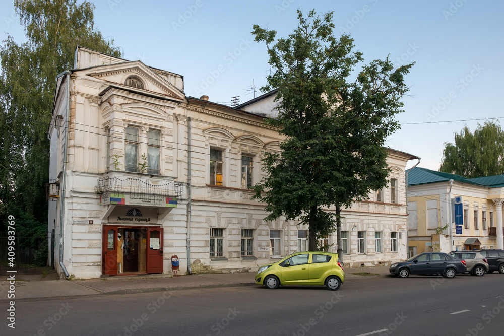 View of an old residential building on Tchaikovsky Street on a summer evening. Gold ring of Russia