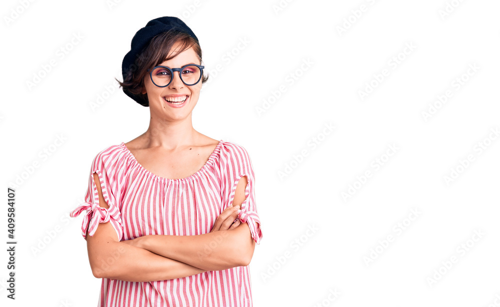Beautiful young woman with short hair wearing casual clothes and glasses happy face smiling with crossed arms looking at the camera. positive person. Beautiful young woman with short hair wearing casual clothes and glasses happy face smiling with crossed arms looking at the camera. positive person.