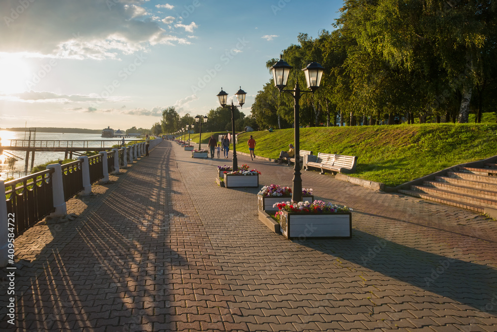 Gold ring of Russia. historical embankment of the Volga River, with sculptures and a walking pedestrian boulevard on a summer evening Gold ring of Russia. historical embankment of the Volga River, with sculptures and a walking pedestrian boulevard on a summer evening
