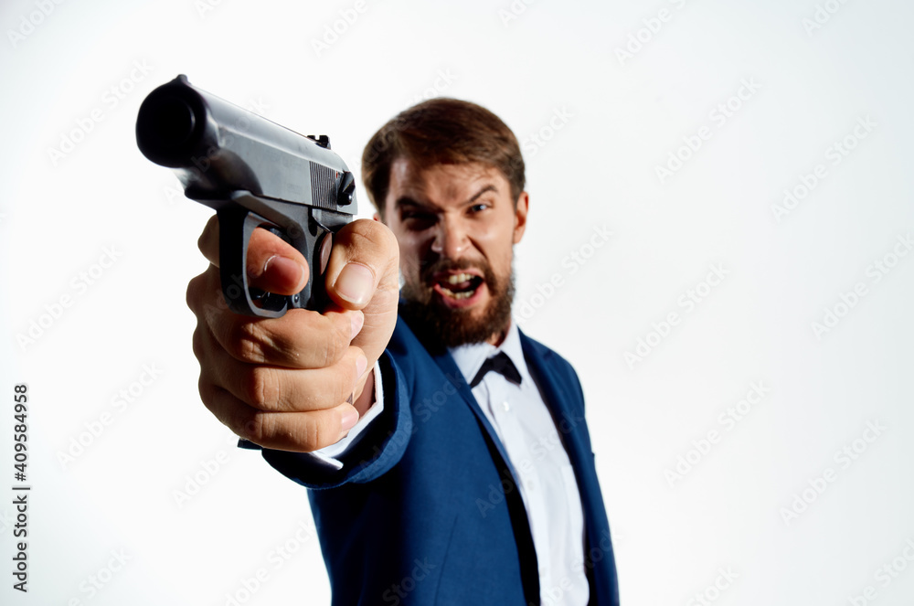 bearded man in suit gun close up killer murder light background bearded man in suit gun close up killer murder light background