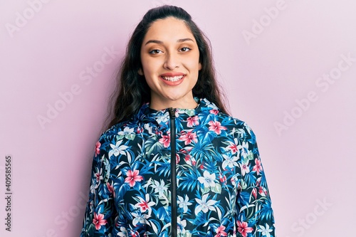 Beautiful middle eastern woman wearing casual floral jacket with a happy and cool smile on face. lucky person.