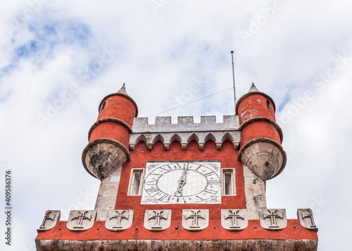 Red clock tower of the Pena National Palace in Sintra town, Portugal