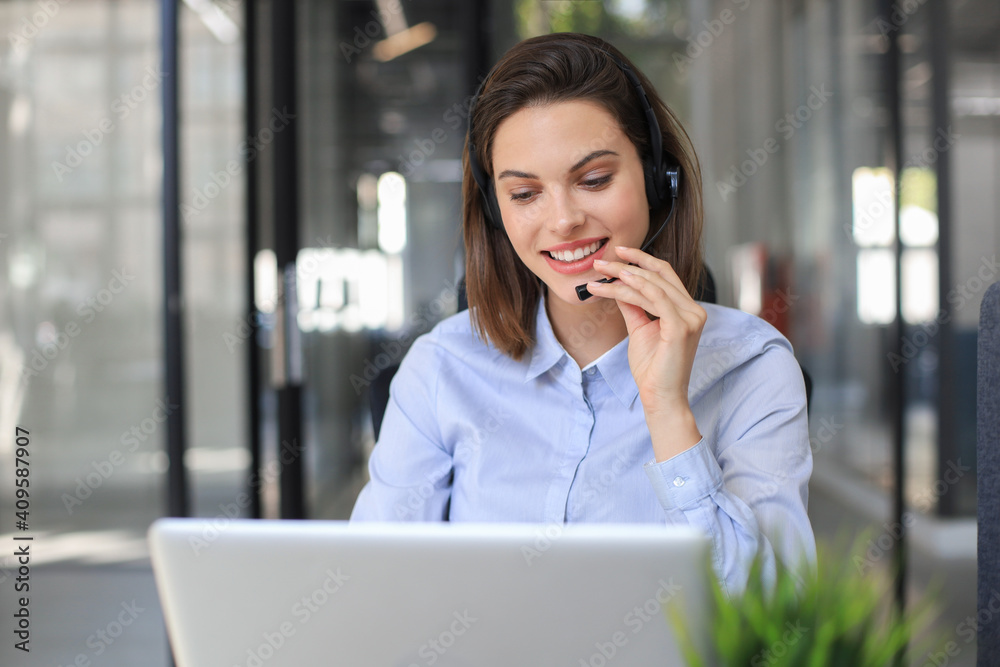 Female customer support operator with headset and smiling. Female customer support operator with headset and smiling.