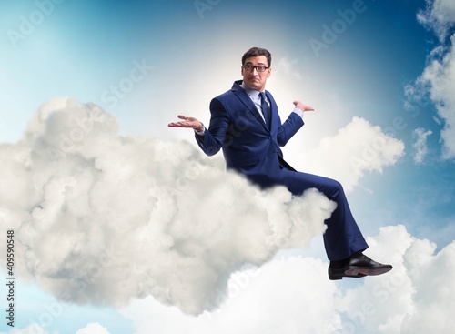 Businessman sitting on the cloud in motivitation concept © Elnur