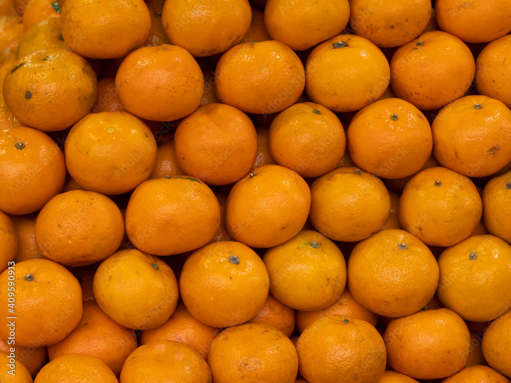 Orange as a background. A large bunch of ripe oranges. Orange as a background. A large bunch of ripe oranges.