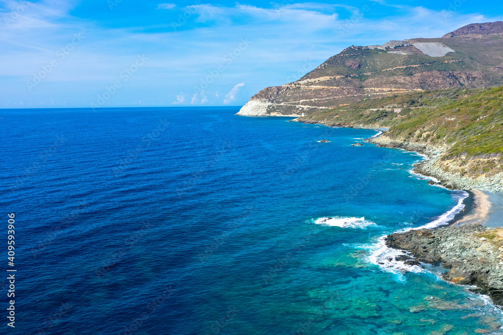 Drone view from the coastal vegetation on the rocky coastline near Erbalunga,  Cap Corse, Corsica, France