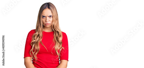 Young beautiful blonde woman wearing casual clothes skeptic and nervous, frowning upset because of problem. negative person. photo