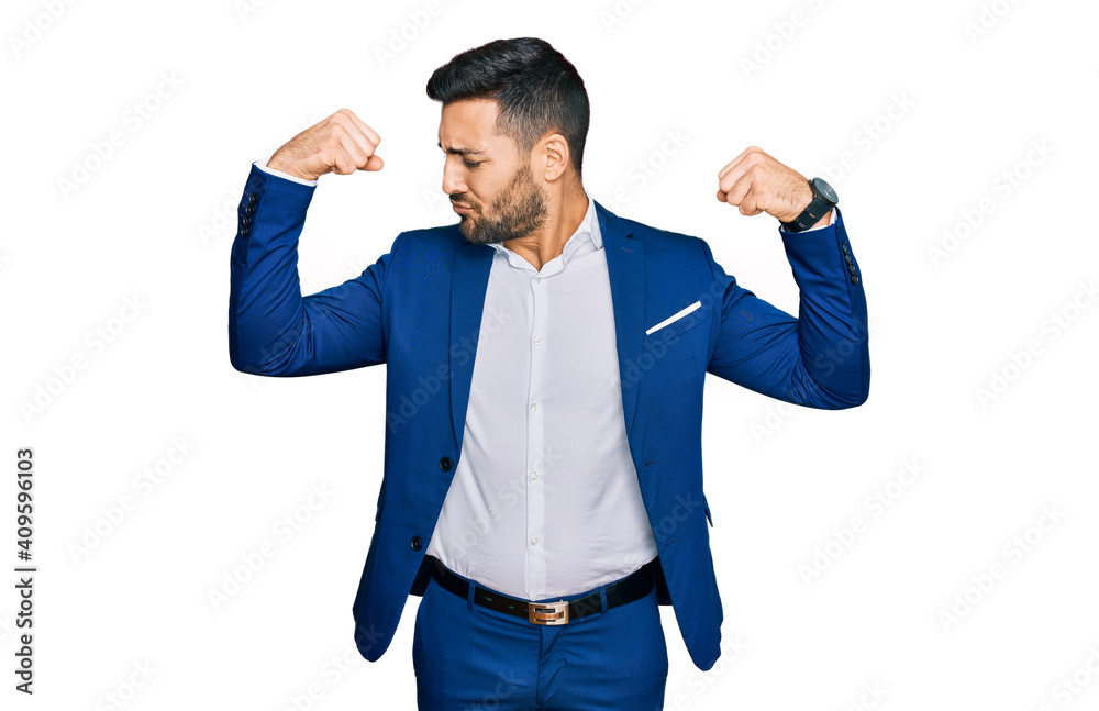 Fototapeta premium Young hispanic man wearing business jacket showing arms muscles smiling proud. fitness concept.