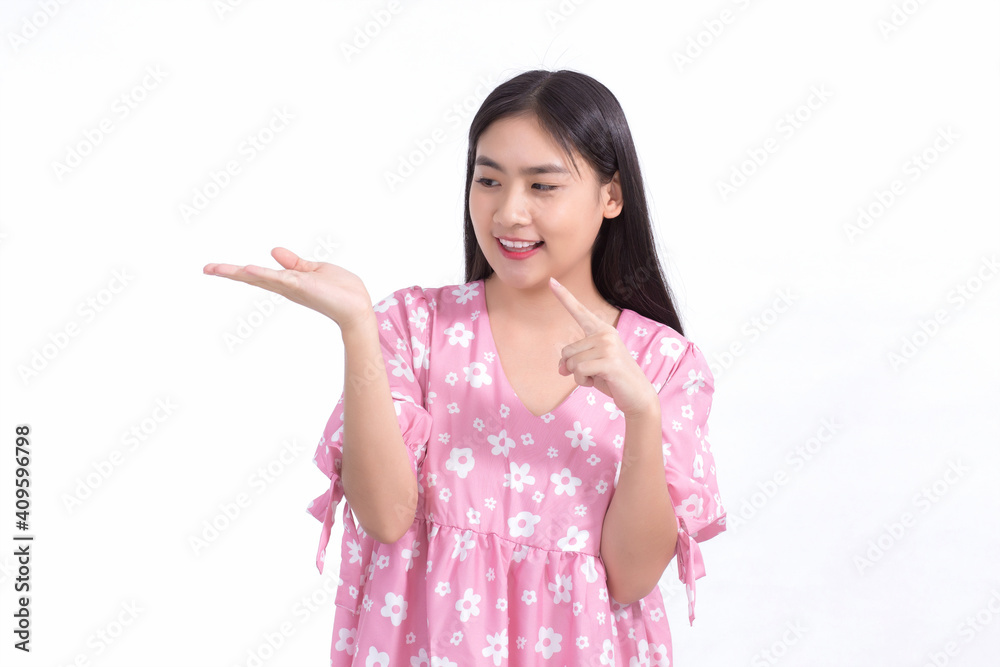 Asian girl acts to present something on the white background. Asian girl acts to present something on the white background.