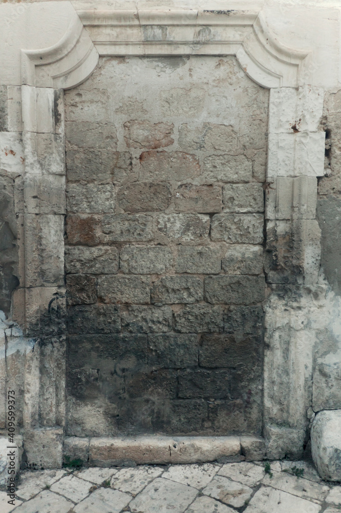 A walled door made of solid gray stone. Symbolic shot: no way out, despair, sadness.
A walled door made of solid gray stone. Symbolic shot: no way out, despair, sadness.