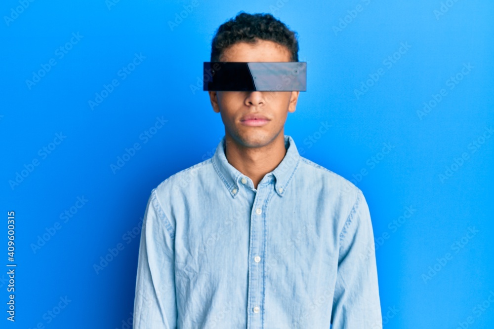 Obraz premium Young handsome african american man wearing banner glasses covering eyes thinking attitude and sober expression looking self confident