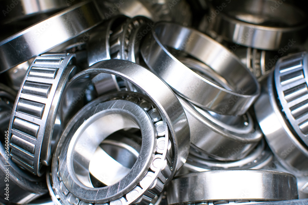 Ball bearings. Industrial steel spare parts close up background. Machinery, engine mechanism, engineering concept. Ball bearings. Industrial steel spare parts close up background. Machinery, engine mechanism, engineering concept.