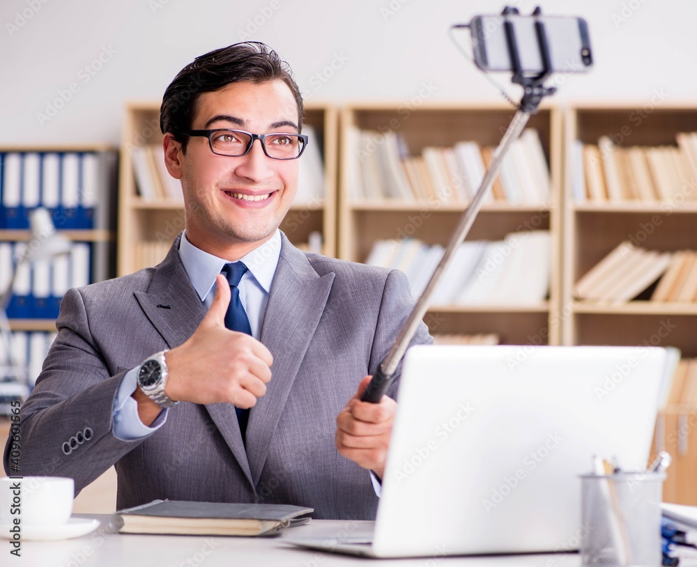 Funny businessman taking selfie in office Funny businessman taking selfie in office