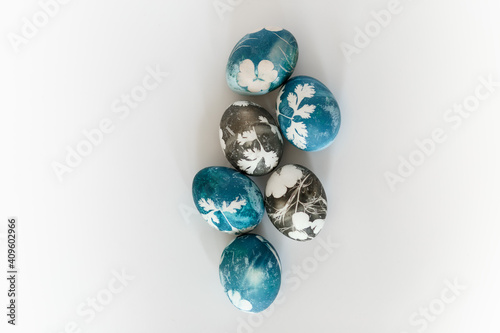 Natural Easter Egg Dye. Easter dyed eggs in blue color. Staining of Easter eggs with red cabbage. Natural ecological staining with food coloring. eggs colored with natural paints. Minimalistic