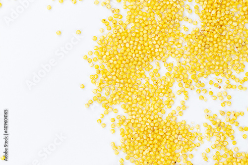 A heap of millet on a white background. Healthy boiled porridge.