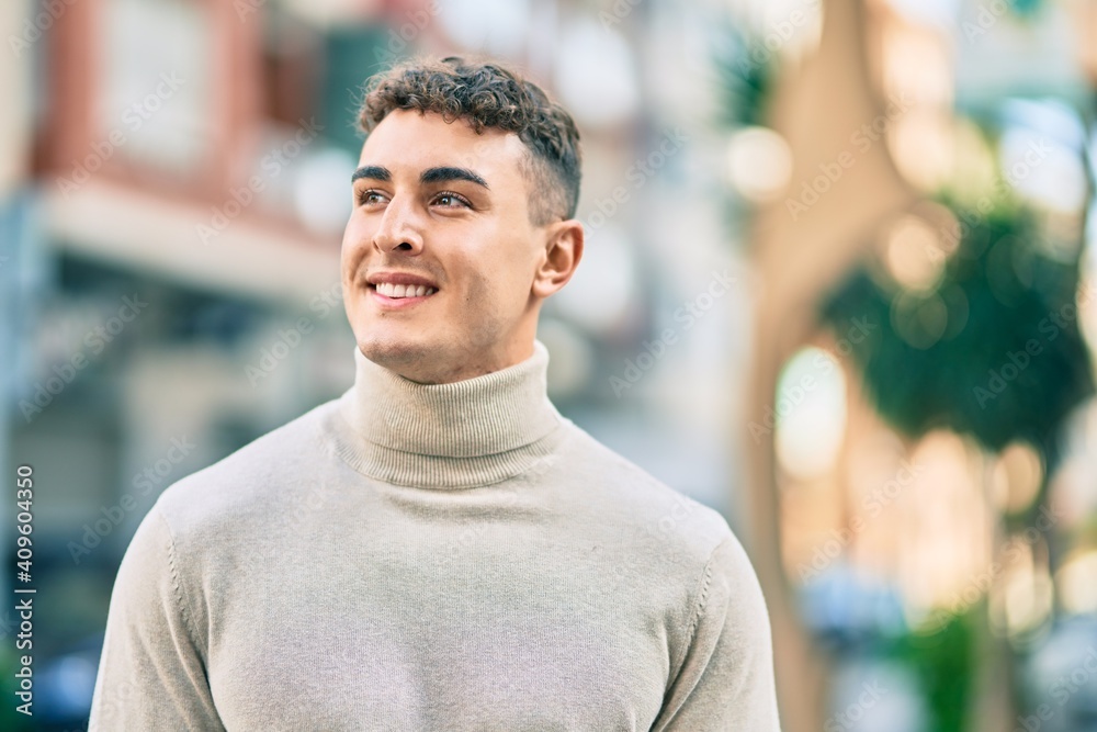 Young hispanic man smiling happy standing at the city. Young hispanic man smiling happy standing at the city.
