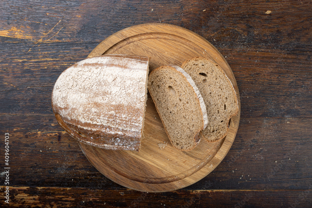 Sliced bread on a cutting board. Sliced bread on a cutting board.