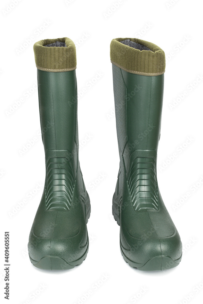 Green rubber boots with a warm toe on a white background. Green rubber boots with a warm toe on a white background.