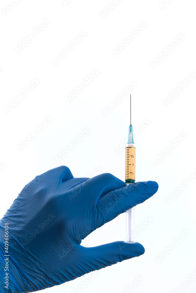 Mans hand in blue glove holds syringe isolated on white, copy space Mans hand in blue glove holds syringe isolated on white, copy space