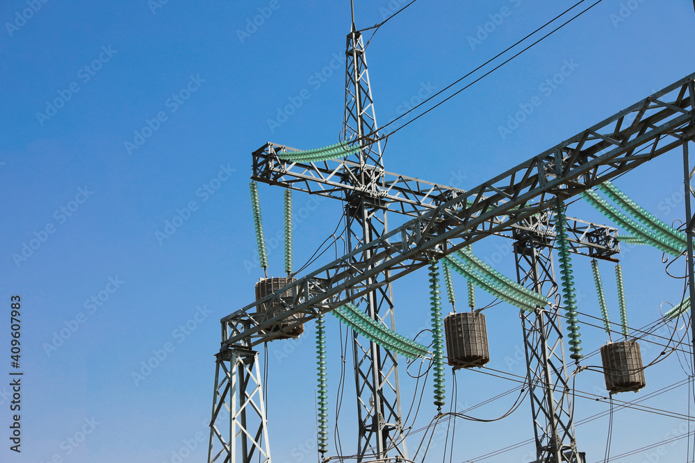 Modern electrical substation on sunny day, low angle view Modern electrical substation on sunny day, low angle view