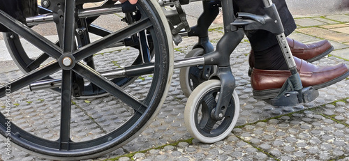 Photography Disabled person on a wheelchair in a park -