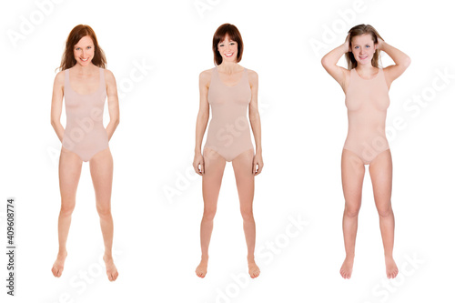Three cheerful young women wearing beige swimsuits, full length portraits, isolated in front of white background
