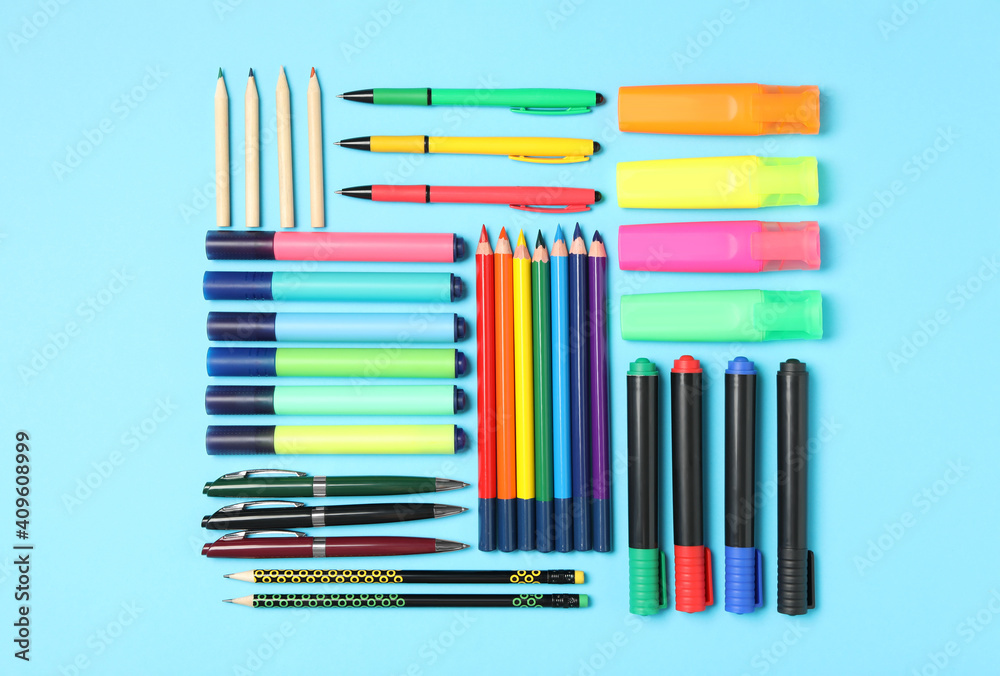 Obraz premium Different stationery on light blue background, flat lay. Back to school