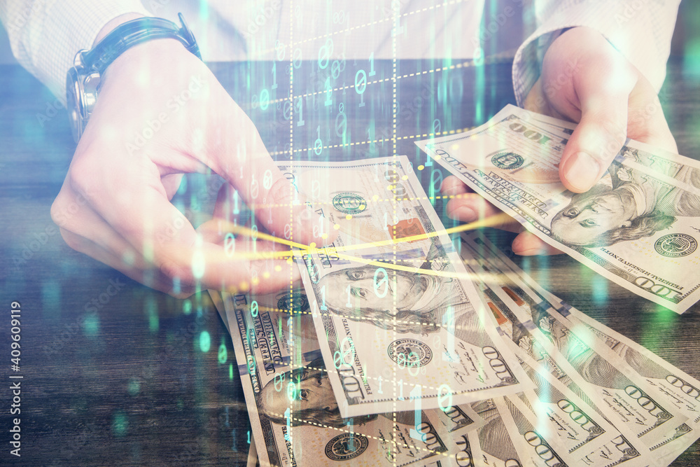 Double exposure of technology drawing hologram and us dollars bills and man hands. Data concept Double exposure of technology drawing hologram and us dollars bills and man hands. Data concept
