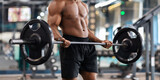 Cropped of black muscular man lifting weights
