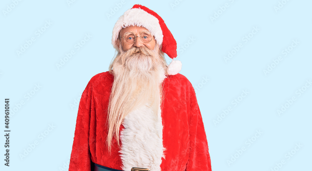 Old senior man with grey hair and long beard wearing traditional santa claus costume with a happy and cool smile on face. lucky person. Old senior man with grey hair and long beard wearing traditional santa claus costume with a happy and cool smile on face. lucky person.