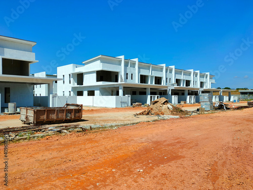 SEREMBAN, MALAYSIA -APRIL 09, 2020: New double story luxury terrace house under construction in Malaysia.  Designed by an architect with a modern and contemporary style.  © Aisyaqilumar