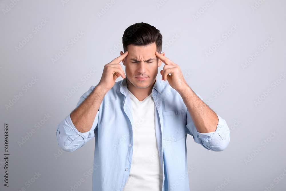Portrait of stressed man on light background Portrait of stressed man on light background