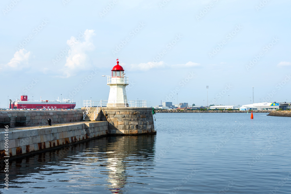 Malmo, Sweden. July 29, 2019, Beautiful lighthouse in the background of the port. Sweden.