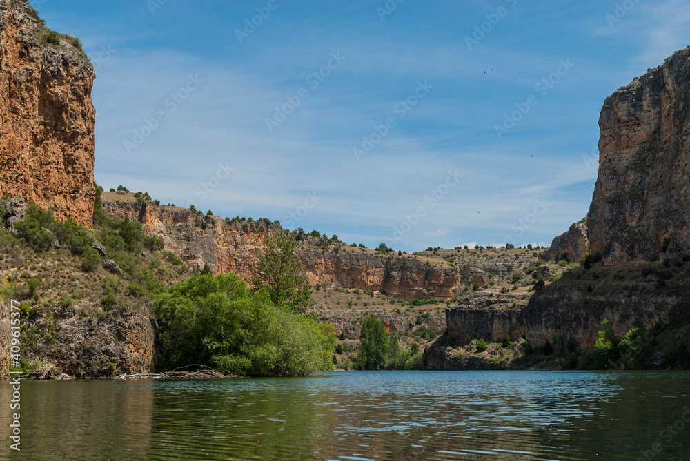 River reservoir with limestone rock canyon in Hoces del Duraton Natural Park