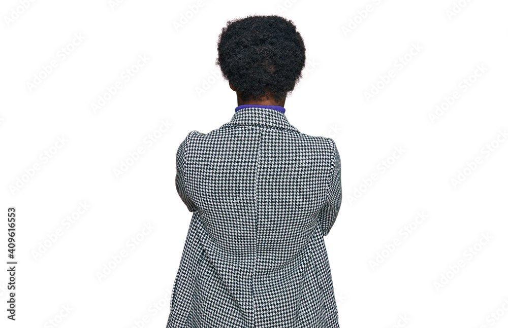 Young african american girl wearing casual clothes standing backwards looking away with crossed arms Young african american girl wearing casual clothes standing backwards looking away with crossed arms