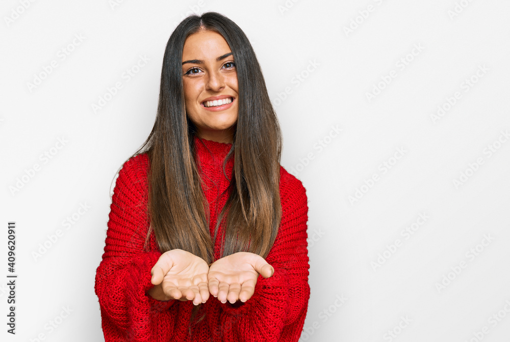 Beautiful hispanic woman wearing casual clothes smiling with hands palms together receiving or giving gesture. hold and protection