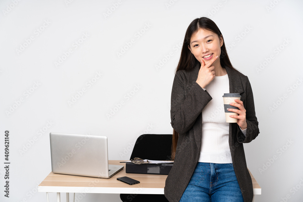 Business asian woman in her workplace isolated on white background smiling Business asian woman in her workplace isolated on white background smiling