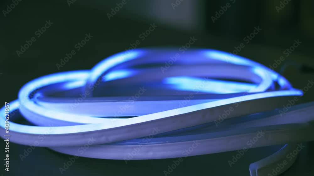 led strip. close-up. neon tape, lamp. lighting device. dynamic, color changing mode of RGBW led strip . Shop of lighting equipment. Modern lamps. New lighting technology, saving energy led strip. close-up. neon tape, lamp. lighting device. dynamic, color changing mode of RGBW led strip . Shop of lighting equipment. Modern lamps. New lighting technology, saving energy