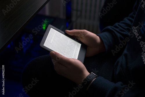 The person is reading the digital book.