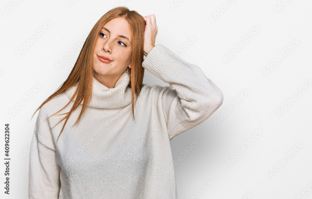 Young irish woman wearing casual winter sweater confuse and wondering about question. uncertain with doubt, thinking with hand on head. pensive concept. Young irish woman wearing casual winter sweater confuse and wondering about question. uncertain with doubt, thinking with hand on head. pensive concept.