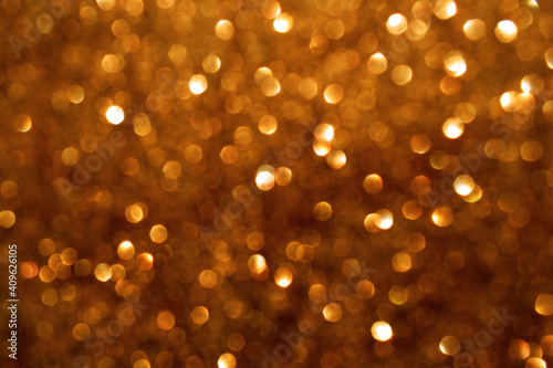 Golden brown bokeh background. New Year, Christmas and all celebration background concept.