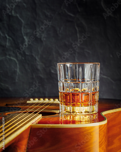 still life with whiskey and acoustic guitar