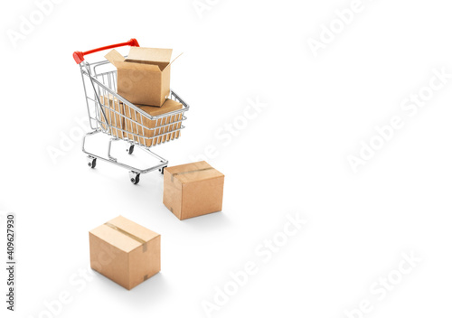 Online Shopping -Carton paper boxes and shopping cart on white background