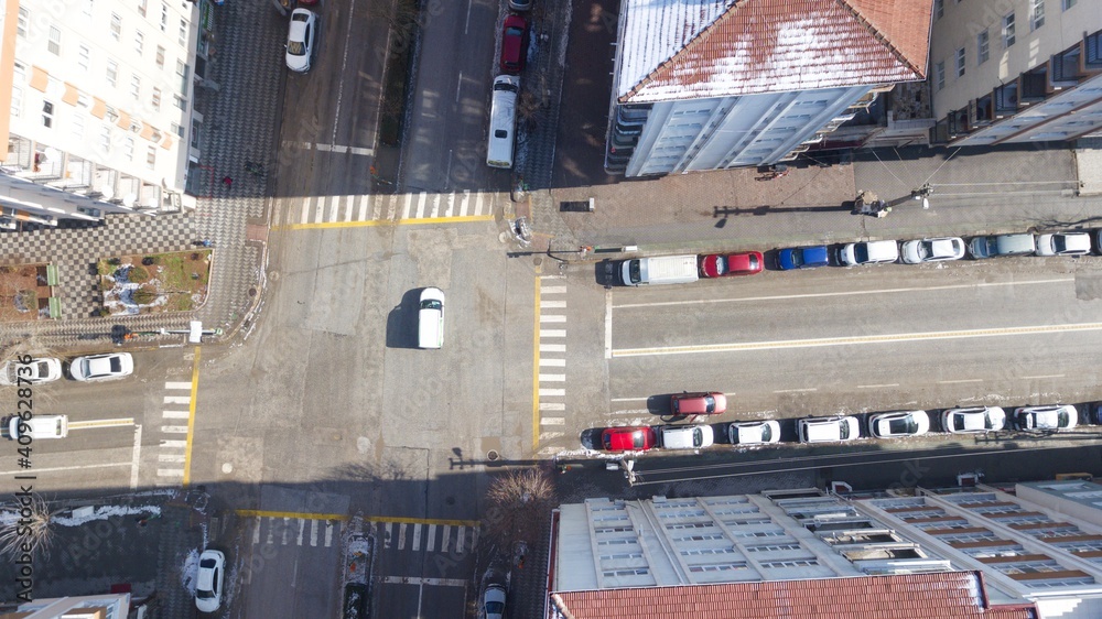Aerial view of crosswalk and empty streets in quarantine days. sunlight seen through buildings. Aerial view of crosswalk and empty streets in quarantine days. sunlight seen through buildings.