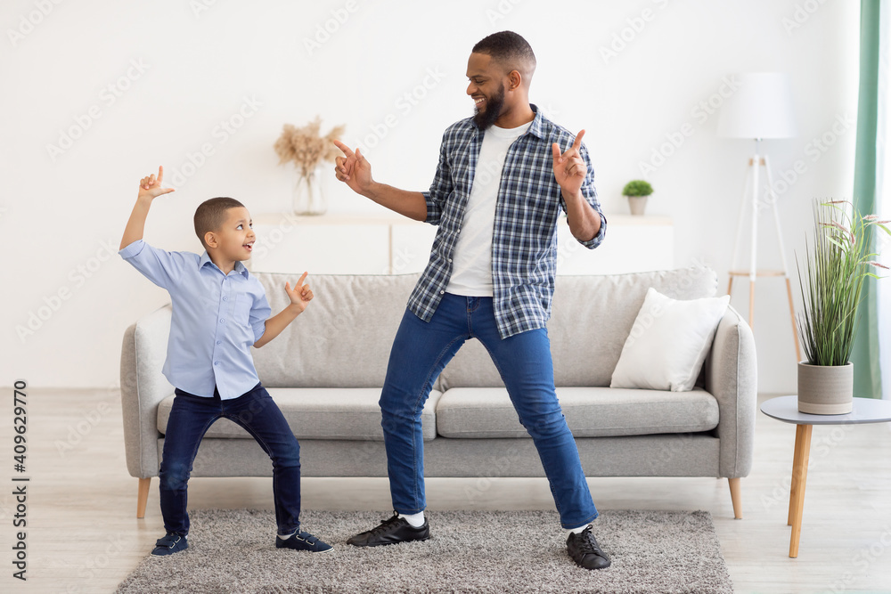 Happy African Father And Son Dancing At Home, Full Length - obrazy, fototapety, plakaty 