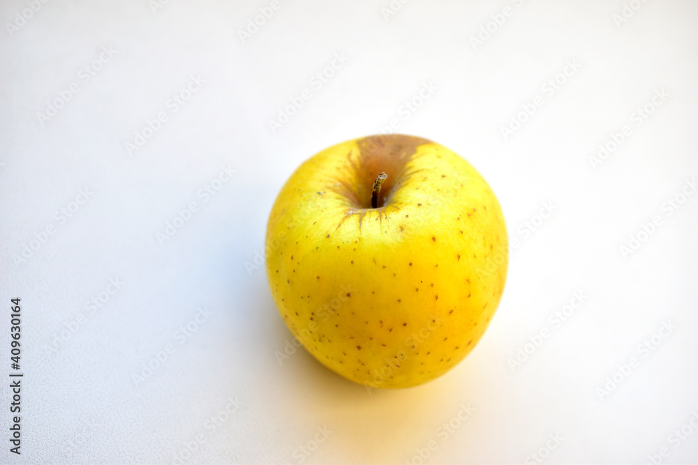Yellow green apple on a white background close up Yellow green apple on a white background close up