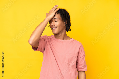 Young african american man isolated on yellow background has realized something and intending the solution
